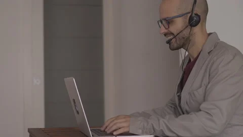 Call center operator is talking with headset. Customer service concept Stock-Footage 142370408