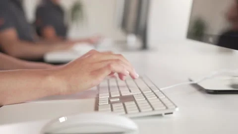 Call center operator, using mouse and keyboard, close up shot Stock Footage 173514697