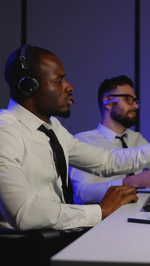 Call center operators working with headsets and computers Stock Footage 305025116