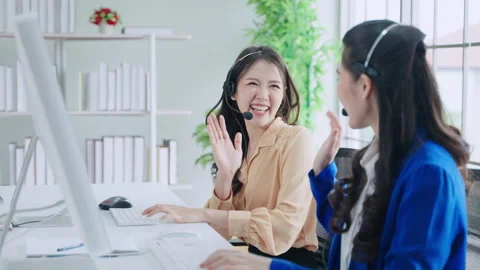 Call center staff are typing keyboards and high five tag team Stock Footage 157134331
