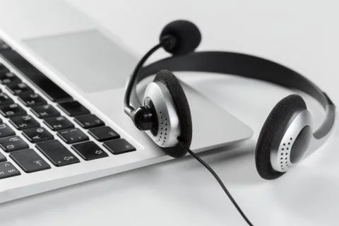 Call center support concept. headset on keyboard computer laptop Stock Photos