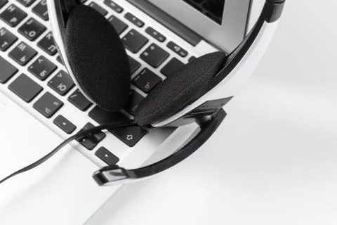 Call center support concept. headset on keyboard computer laptop Stock Photos