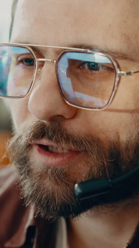 Call center, telemarketer and man with headset, chat and discussion with contact Stock Footage 338171168