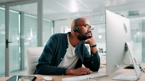 Call center, thinking and black man in office bored for customer service, online Stock Footage 309037837