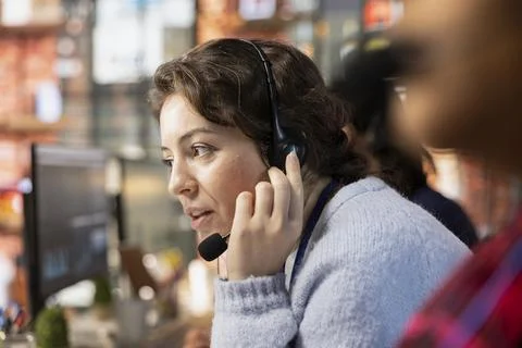 Call center worker creating support ticket for customer calling to solve issue Foto stock