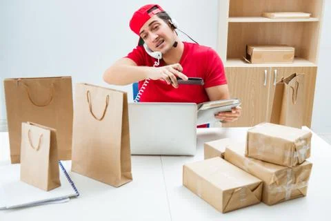 Call center worker at parcel distribution center in post office Stock Photos