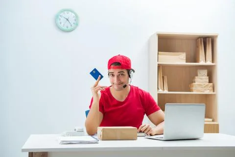Call center worker at parcel distribution center in post office Stockfoto's