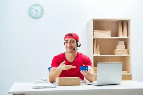 Call center worker at parcel distribution center in post office Stock Photos