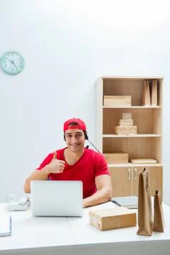 Call center worker at parcel distribution center in post office Stock Photos