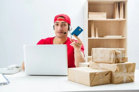 Call center worker at parcel distribution center in post office Stock Photos