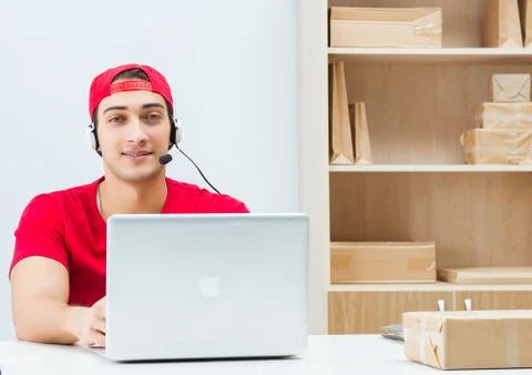 Call center worker at parcel distribution center in post office Stock Photos