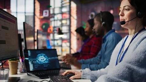 Call center worker using artificial intelligence software 스톡 사진