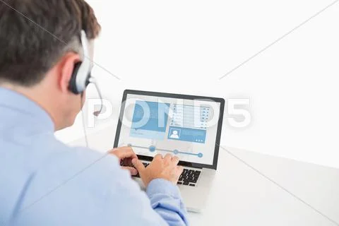 Call center worker viewing his social media profile Stock Photos
