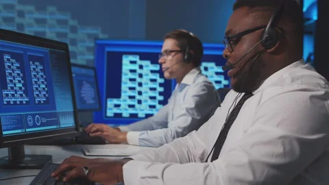 Call-center workers are speaking with the clients by headset. Workplace of the Stock Footage 145716663