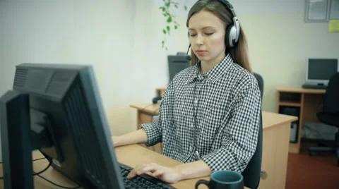 Call centre agents working in their bright office Stock Footage 61722722