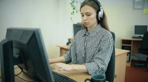 Call centre agents working in their bright office Stock Footage 61722802