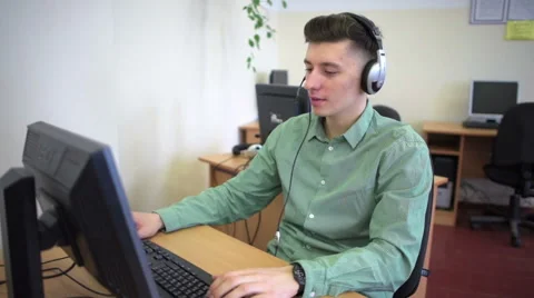 Call centre agents working in their bright office Stock Footage 61723070