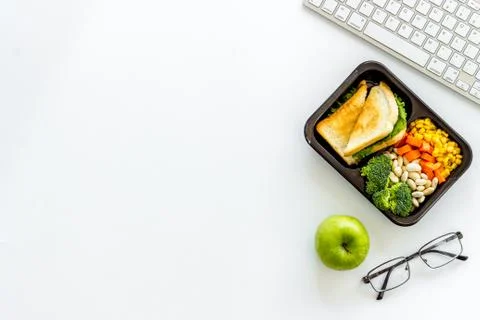 Call for delivery concept. Lunch boxes with meal on working place Stock Photos