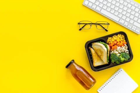 Call for delivery concept. Lunch boxes with meal on working place Stock Photos