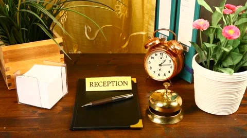 Call on hotel bell with key delivery on a wood stand 動画素材 45870656