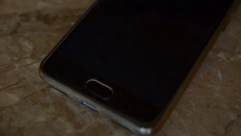 Call on mobile phone lying on desk in office Stock Footage 73955771