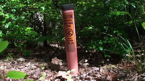 "Call before you dig"  warning sign "Fiber Optic Cables buried below" Stock Footage 24305553