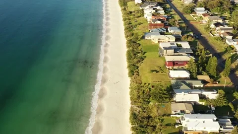Callala beach town waterfront on white sand Jervis bay beach – aerial 4k. Stock Footage 226756831