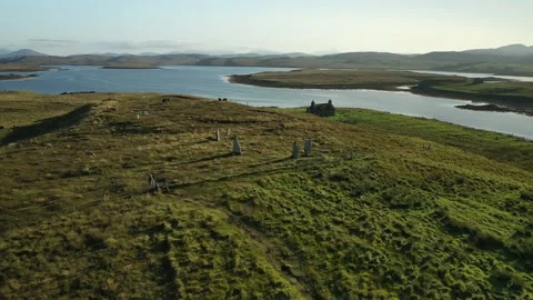 Callanish ll Stone Circle Drone Circling with lakes behind, Scotland 4K Stock Footage 152750771