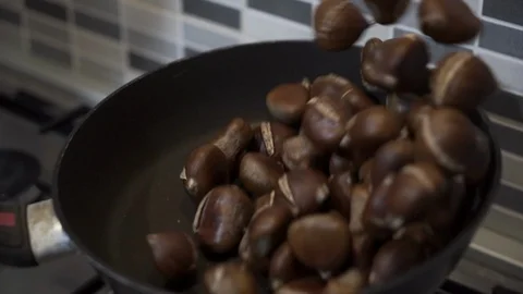 Called castanhas assadas ("roasted chestnuts") in Portuguese. Stock Footage 117042102
