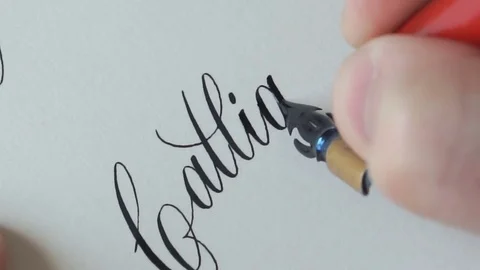 Calligrapher writing a word Stock Footage 76968348