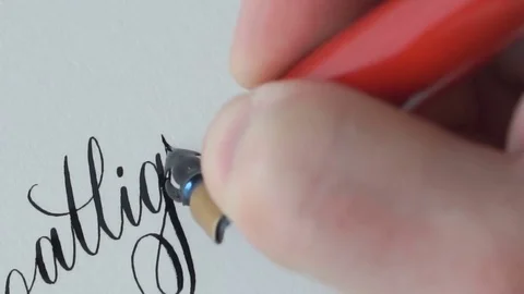 Calligrapher writing a word Stock Footage 76968425