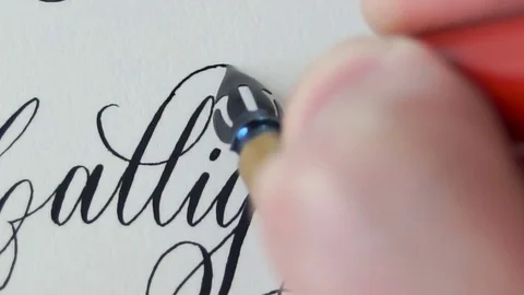 Calligrapher writing a word Stock Footage 76968478