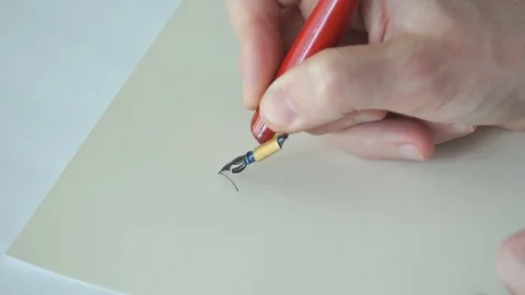 Calligrapher writing a word Stock Footage 76968747