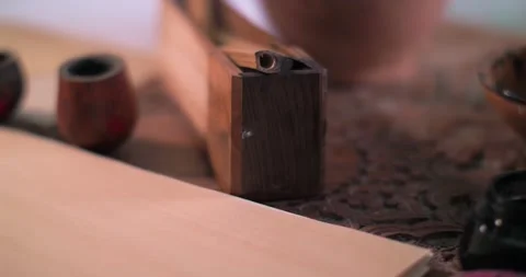 A calligrapher's hand dips a stylo into an inkwell and writes a letter on Stock Footage 308011889