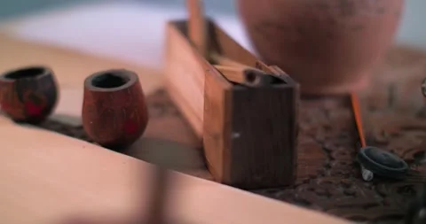 A calligrapher's hand dips a stylo into an inkwell and writes a letter on Stock Footage 341290186
