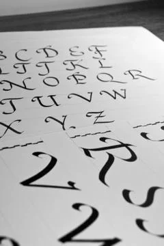 Calligraphic letters Stock Photos