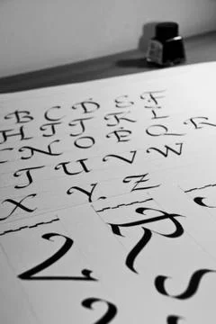 Calligraphic letters Stock Photos