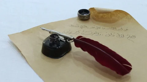 Calligraphy Arabic writing on an old paper Stock Footage 105318560