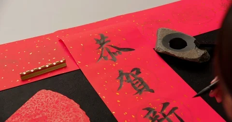 Calligraphy with red spring couplet Stock Footage 121257419