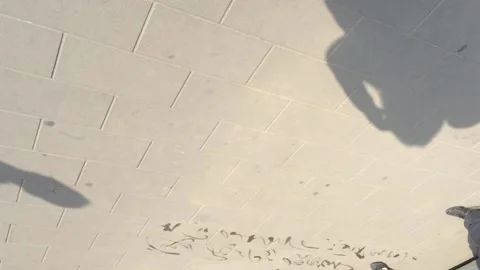 Calligraphy teaching on the ground Stock Footage 133447167