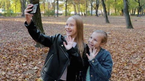 Calling concept with webcam. Remote communication of two kids girls  Stock Footage 167888901