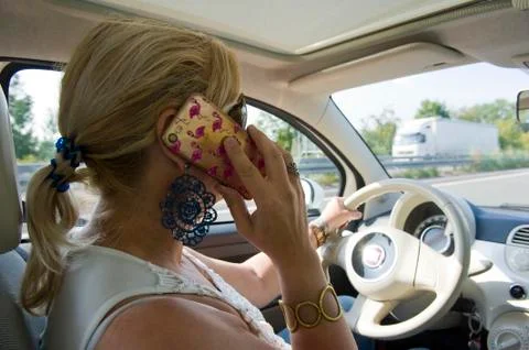 Calling while driving Stock Photos