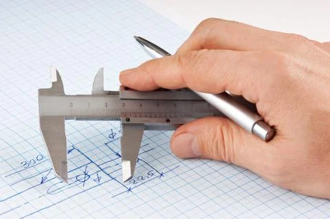 Callipers in hand Stock Photos