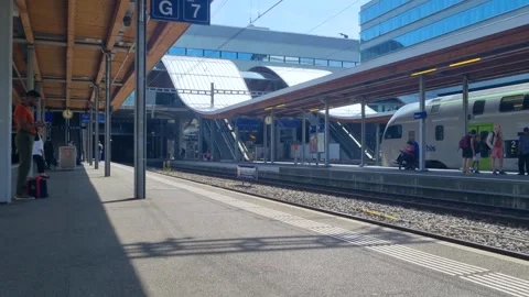 Calm afternoon at Bern Central Station, Switzerland, with commuters and Stock Footage 346172997