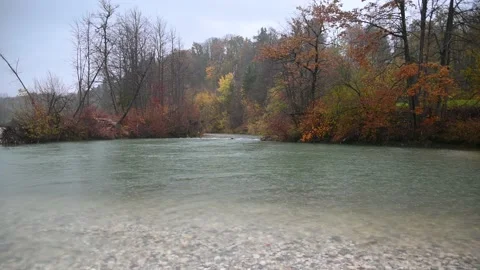 Calm alpine river flows in the canyon on a rainy day Stock Footage 225690982