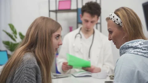 A calm and matter-of-fact conversation between a mother and daughter about test Stock Footage 152361732