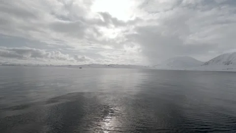 Calm Arctic Waters Under Dramatic Polar Sky in Svalbard, Norway Stock Footage 339277707