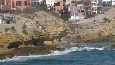 Calm Atlantic Ocean Waves Splashing on Cliffs in Small Village in Morocco Stock Footage 171514643