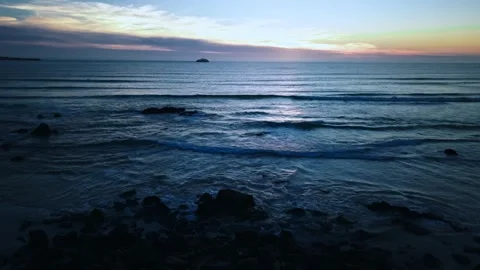 Calm Atlantic Ocean waves at sunset with rocky coast aerial Stock Footage 331194445