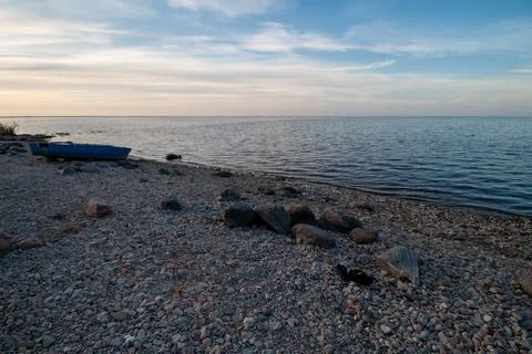 Calm Beach at Dusk Stock Photos